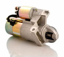 starter motor by itself on a white background
